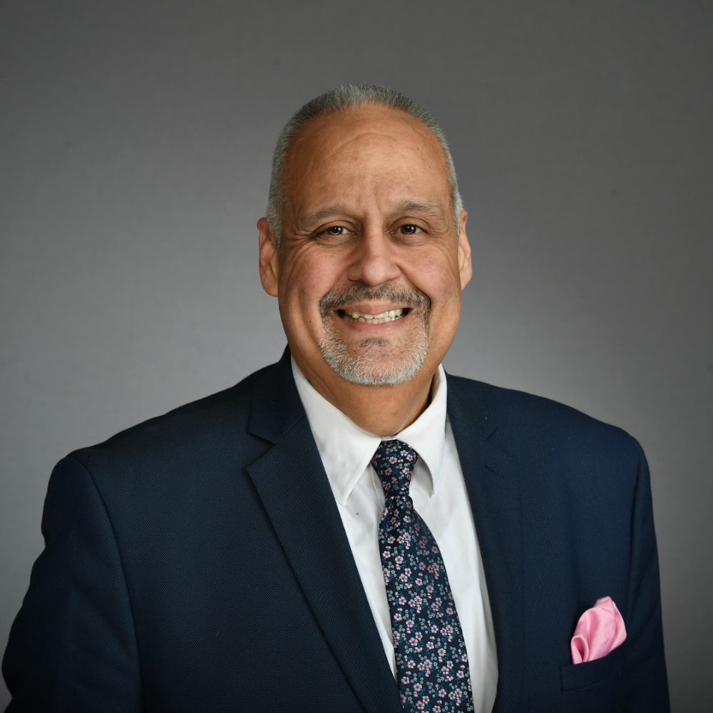 Headshot of Alain Silverio smiling.