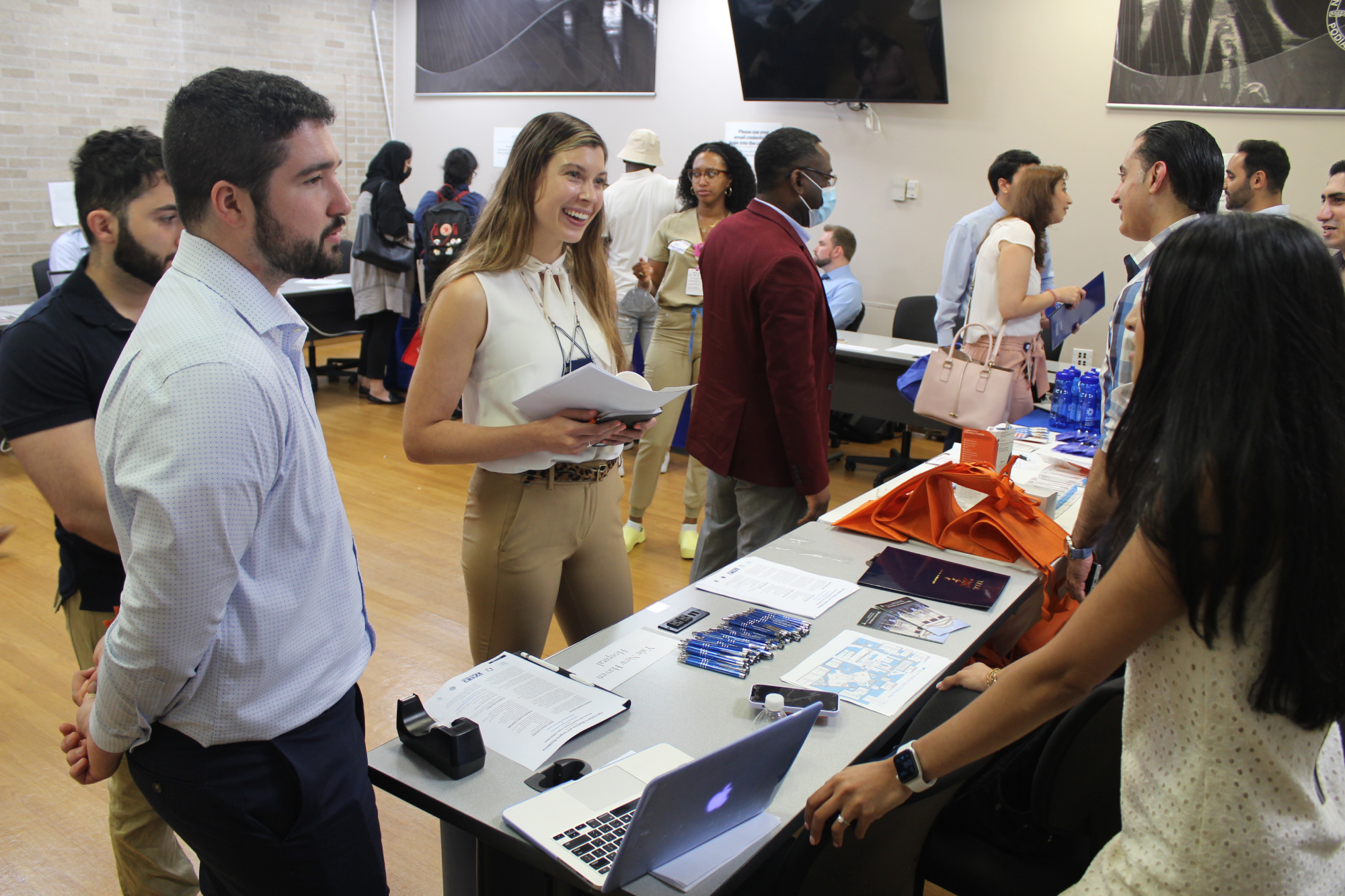 NYCPM students talking to representative at Residency fair