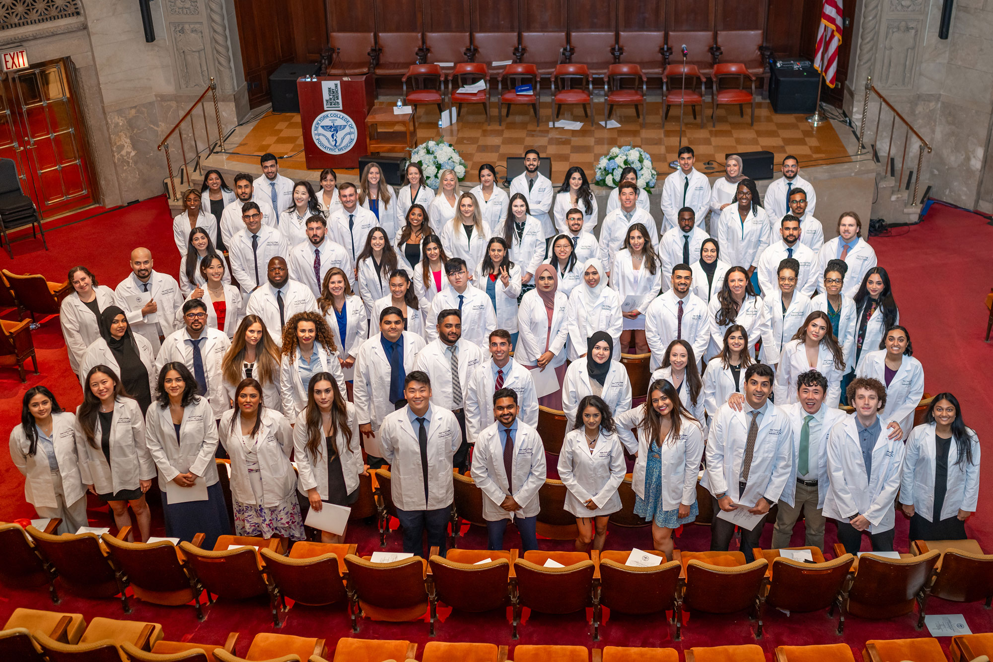 Large group of NYCPM students standing on stage at WCC